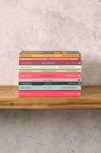 Faber Editions paperbacks stacked on a wooden shelf
